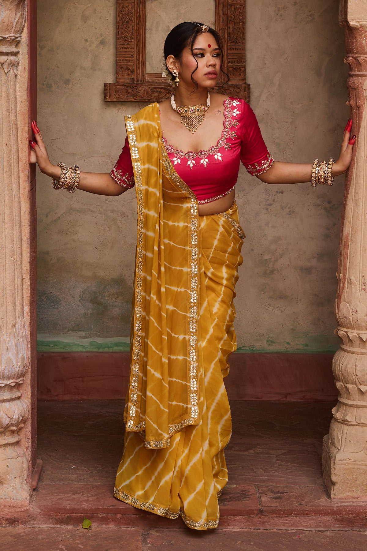 Kanak – Mustard Yellow Leheriya Saree and Rani Pink Blouse