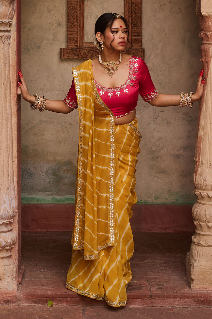 Kanak – Mustard Yellow Leheriya Saree and Rani Pink Blouse