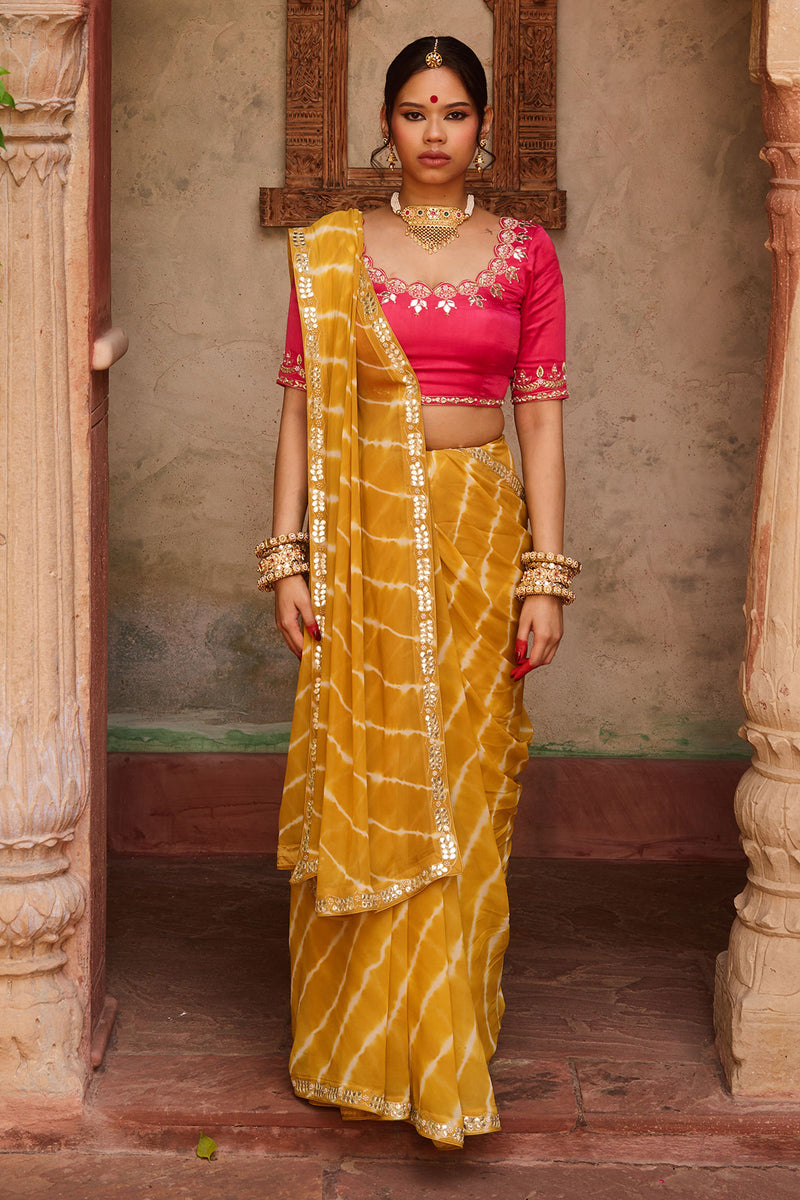 Kanak – Mustard Yellow Leheriya Saree and Rani Pink Blouse
