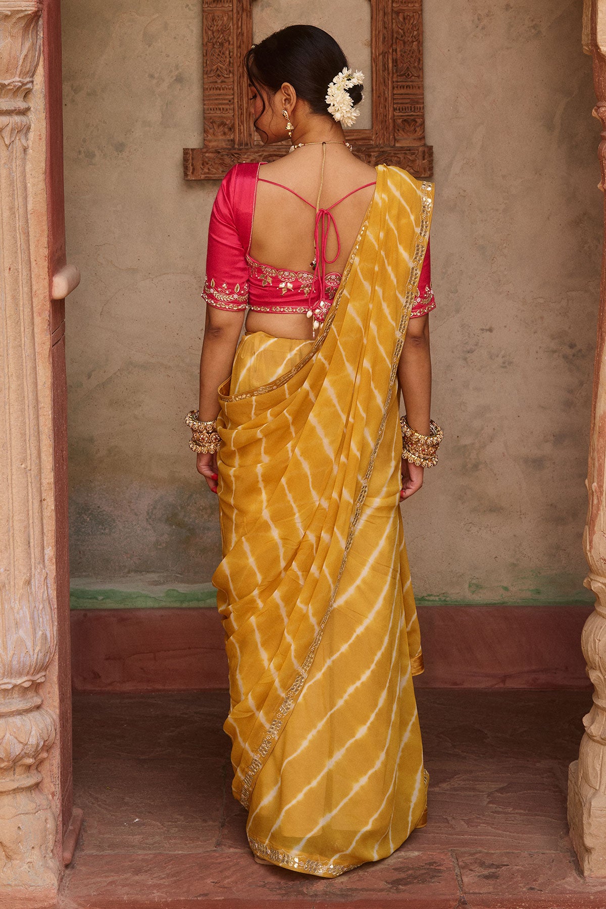 Kanak – Mustard Yellow Leheriya Saree and Rani Pink Blouse