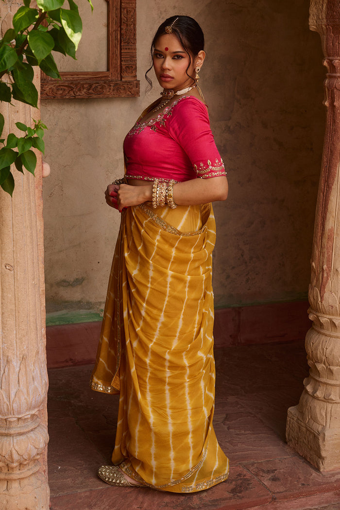 Kanak – Mustard Yellow Leheriya Saree and Rani Pink Blouse