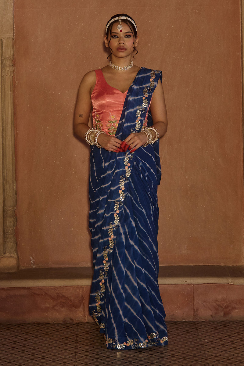 Roopmati – Navy Blue Leheriya Saree with Peach Corset Blouse