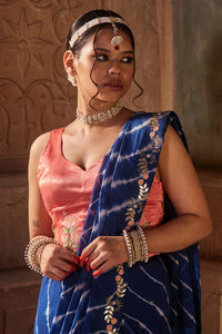 Roopmati – Navy Blue Leheriya Saree with Peach Corset Blouse