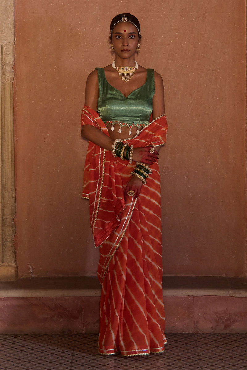 Palash – OrangeLeheriya Saree with Deep Sage Green Kaudi Blouse