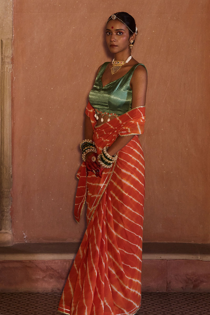 Palash – OrangeLeheriya Saree with Deep Sage Green Kaudi Blouse