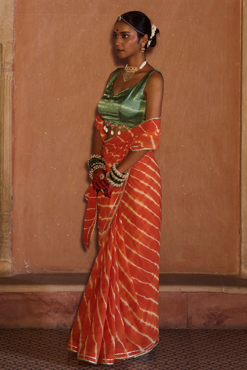 Palash – OrangeLeheriya Saree with Deep Sage Green Kaudi Blouse