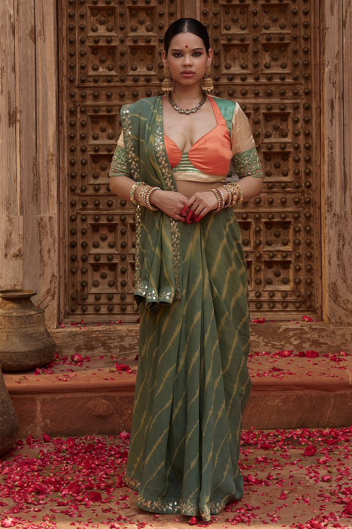 Gajgamini – Sage Green Leheriya Saree with Tri-Colour Panelled Blouse