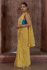 Surajmukhi – Ray Yellow Leheriya Saree with Blue Strings Blouse
