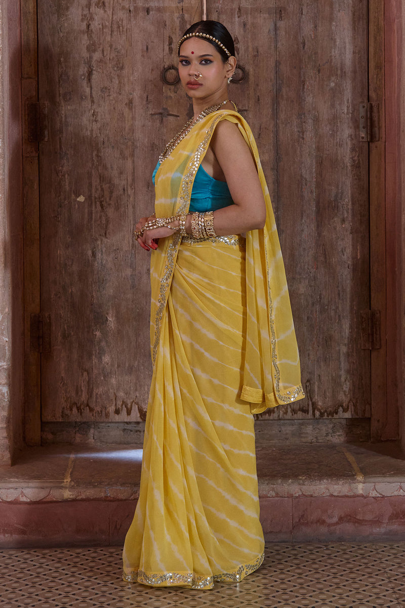 Surajmukhi – Ray Yellow Leheriya Saree with Blue Strings Blouse