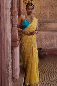 Surajmukhi – Ray Yellow Leheriya Saree with Blue Strings Blouse