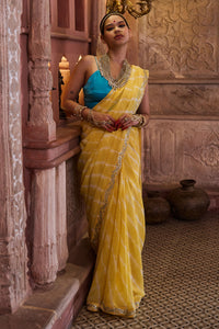 Surajmukhi – Ray Yellow Leheriya Saree with Blue Strings Blouse