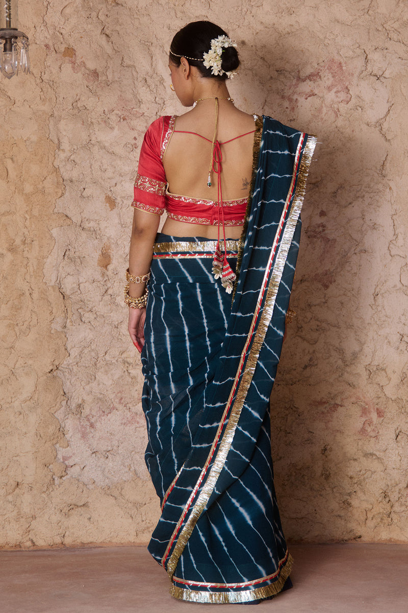 Utsavi – Bottle Green Leheriya Saree with Crimson Red Blouse