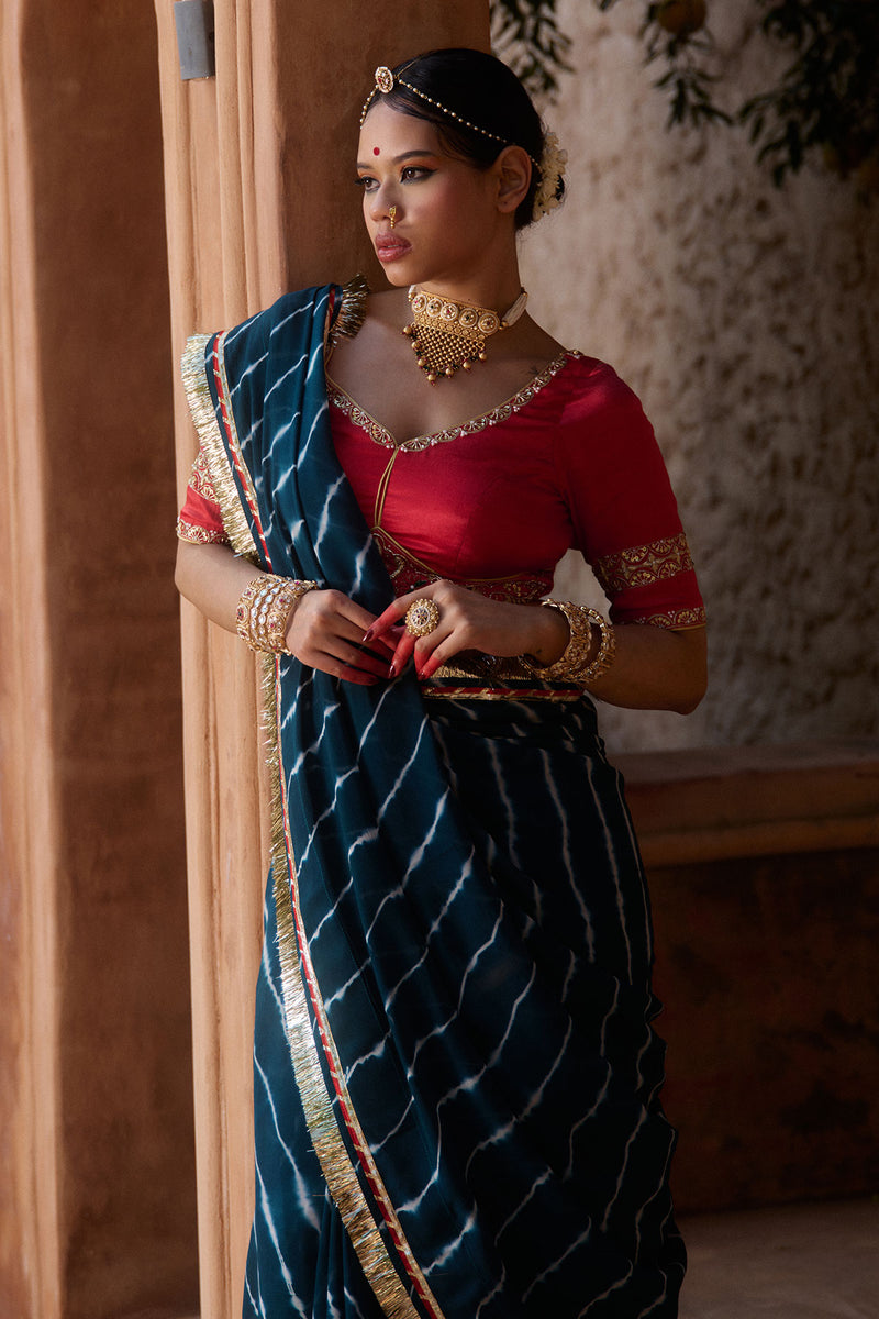 Utsavi – Bottle Green Leheriya Saree with Crimson Red Blouse