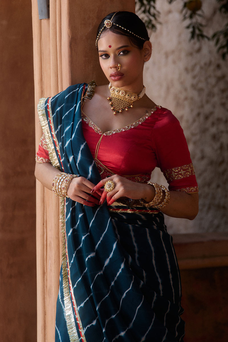 Utsavi – Bottle Green Leheriya Saree with Crimson Red Blouse