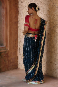 Utsavi – Bottle Green Leheriya Saree with Crimson Red Blouse