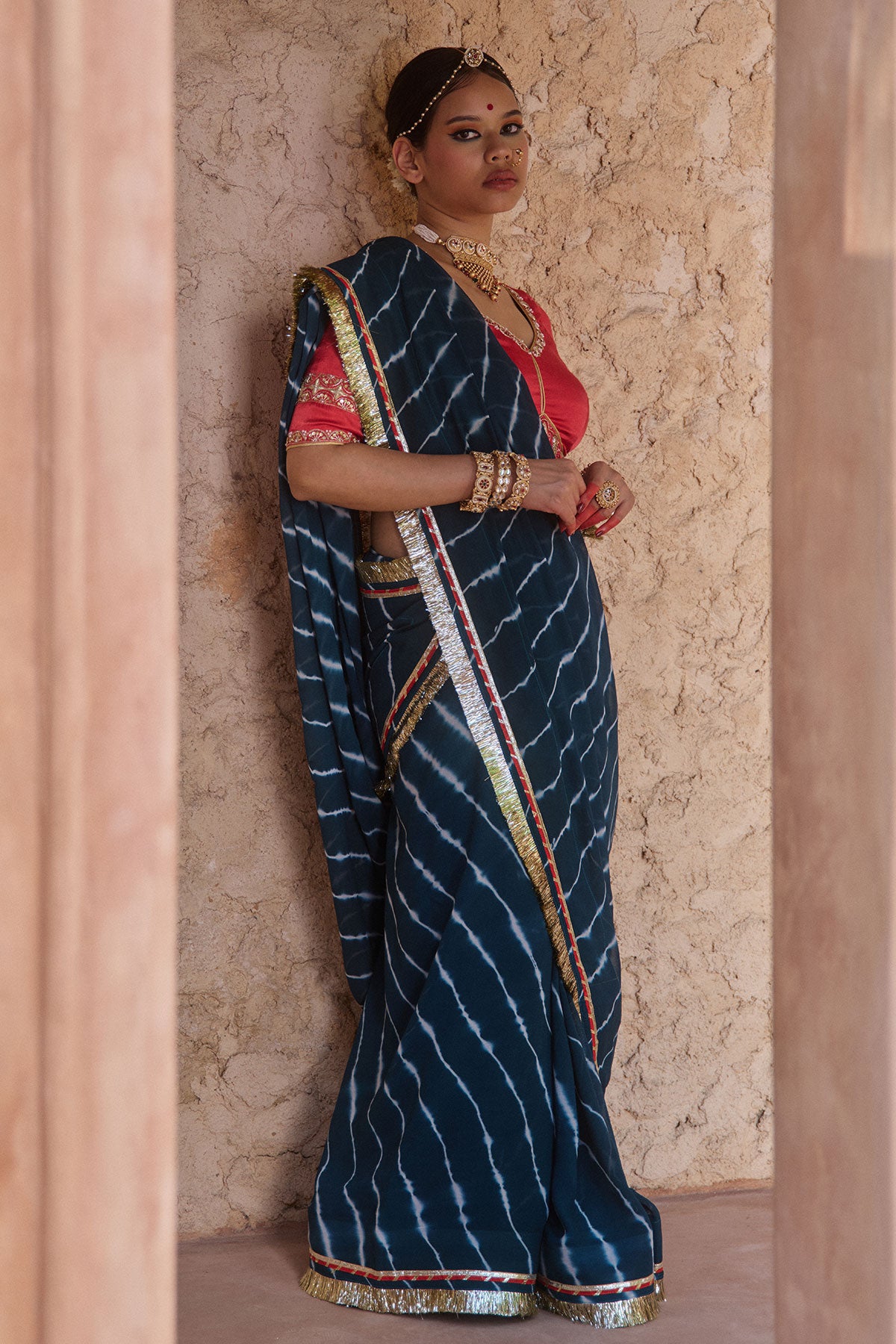 Utsavi – Bottle Green Leheriya Saree with Crimson Red Blouse