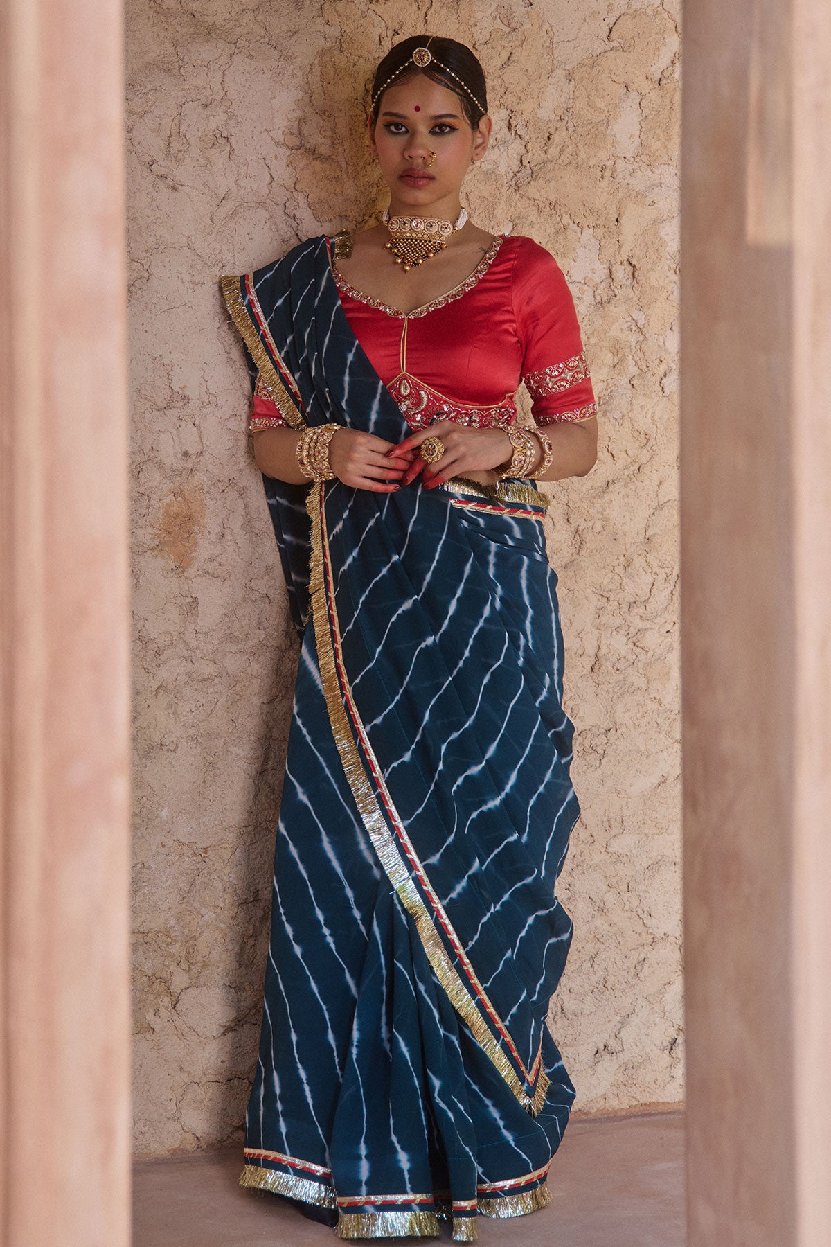 Utsavi – Bottle Green Leheriya Saree with Crimson Red Blouse