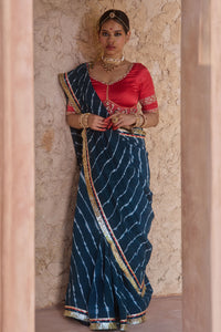 Utsavi – Bottle Green Leheriya Saree with Crimson Red Blouse