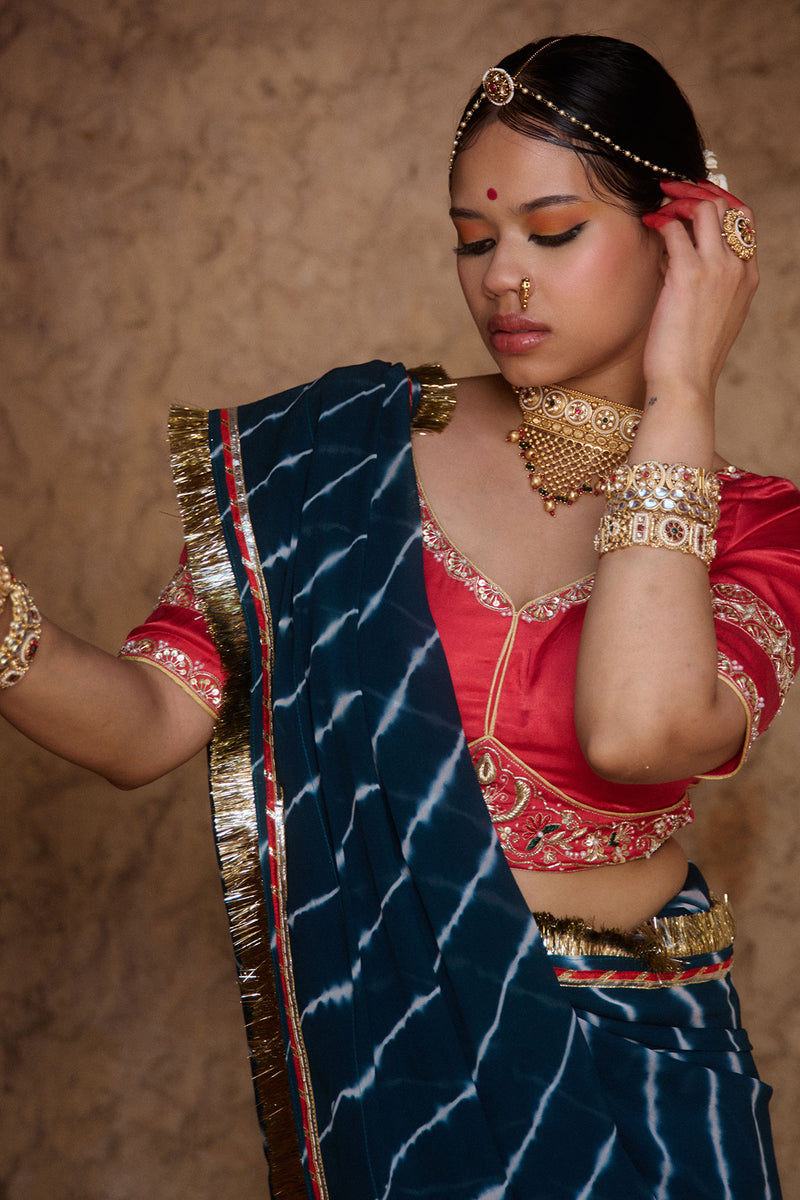 Utsavi – Bottle Green Leheriya Saree with Crimson Red Blouse