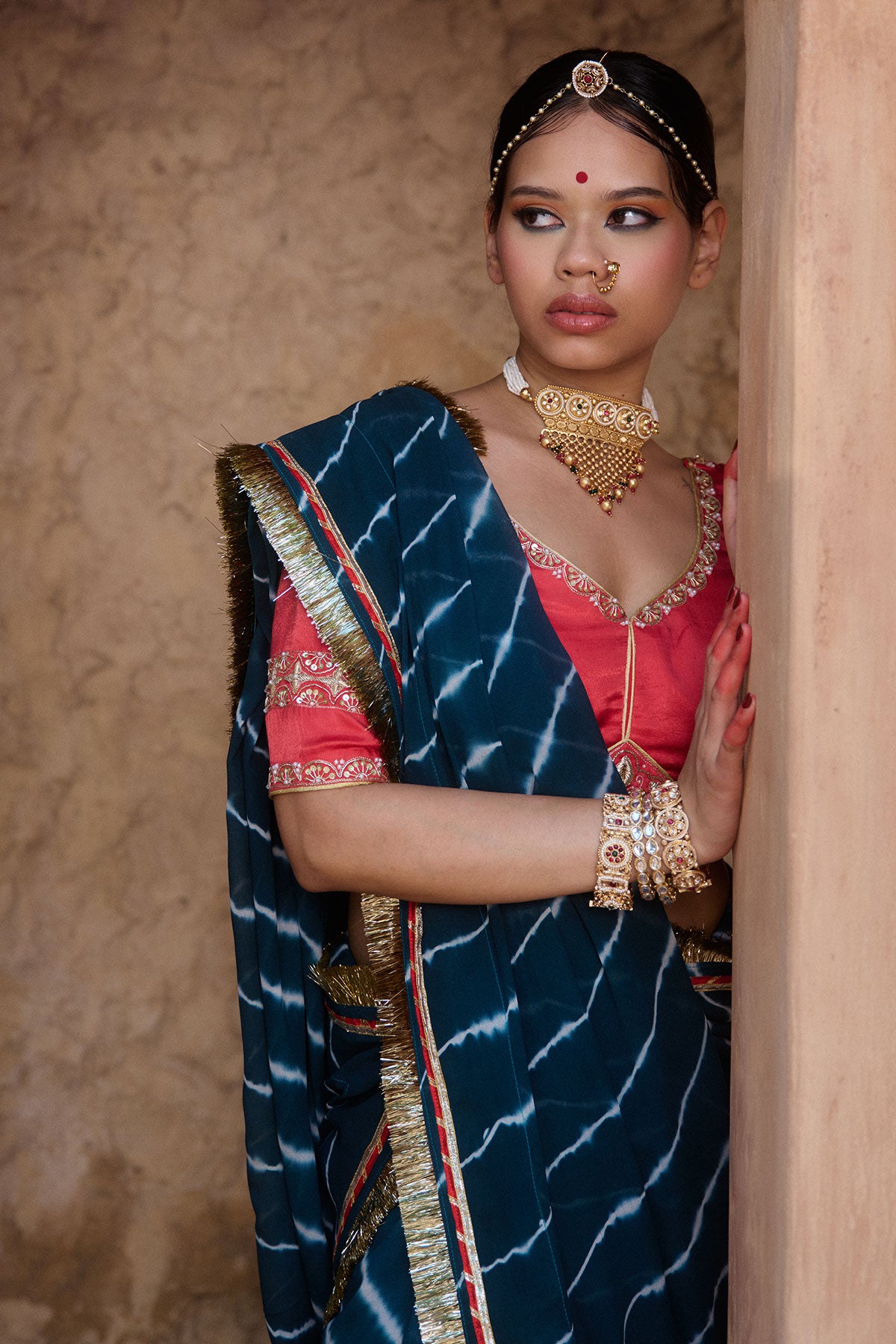 Utsavi – Bottle Green Leheriya Saree with Crimson Red Blouse