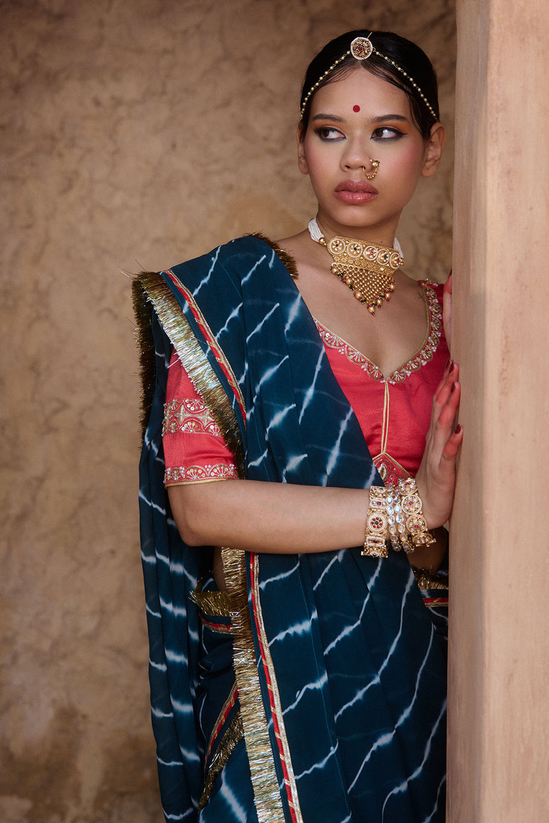 Utsavi – Bottle Green Leheriya Saree with Crimson Red Blouse