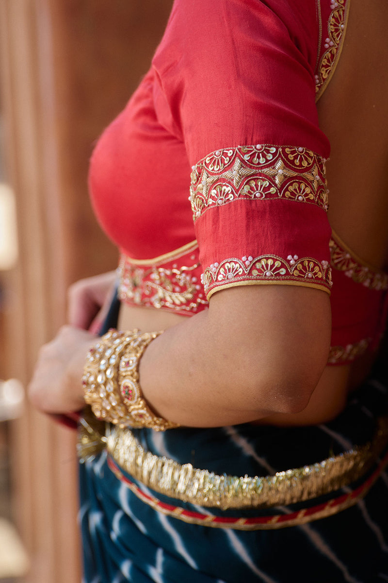 Utsavi – Bottle Green Leheriya Saree with Crimson Red Blouse