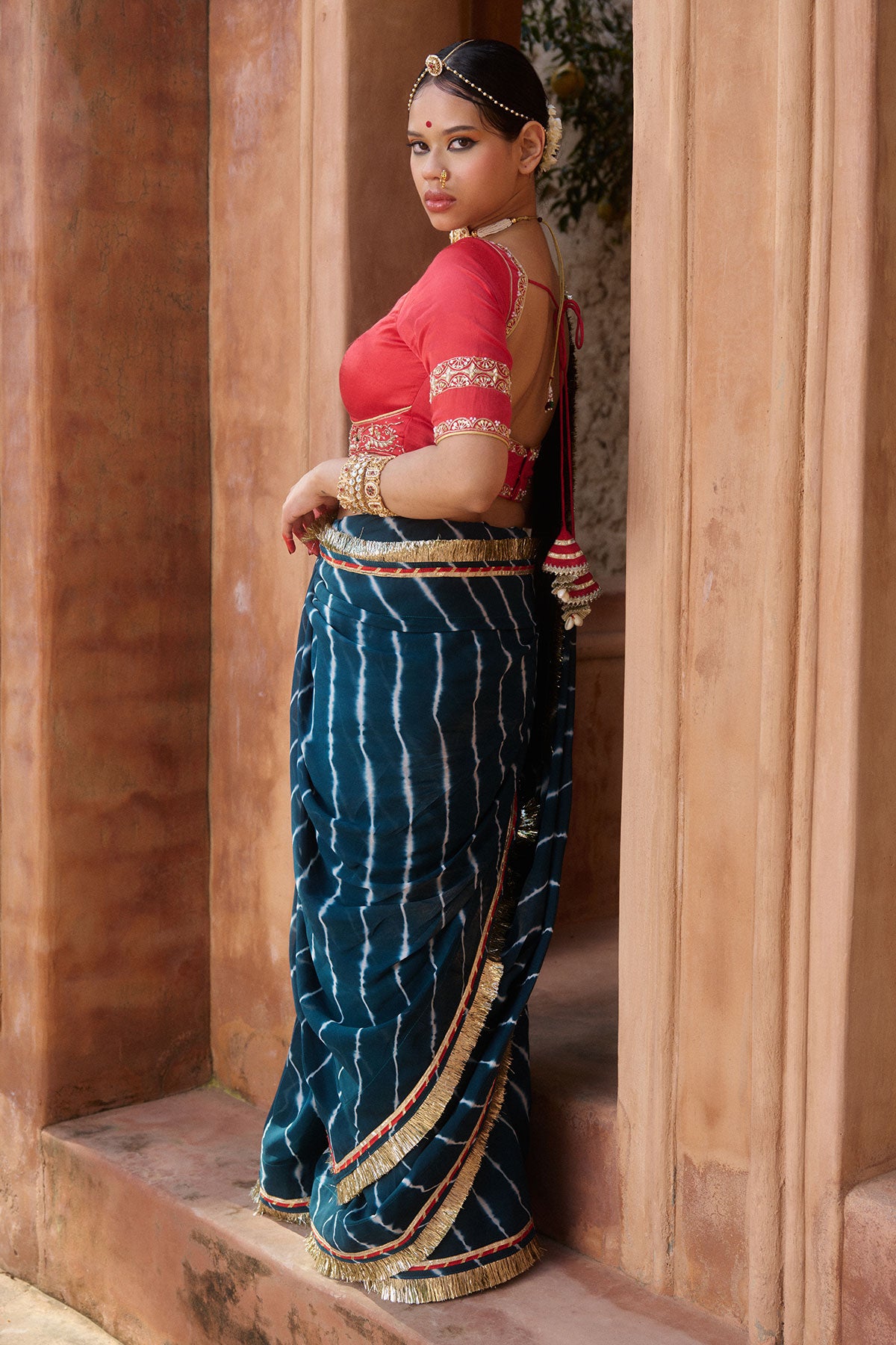 Utsavi – Bottle Green Leheriya Saree with Crimson Red Blouse