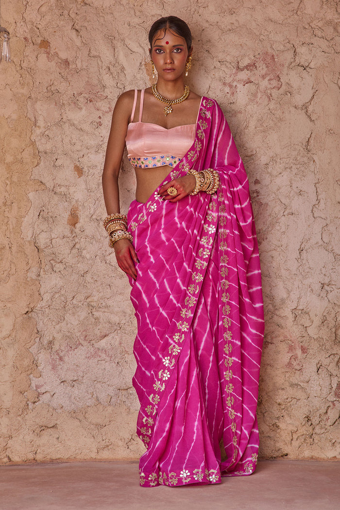Raj Nikhar – Beetroot Purple Leheriya Saree with Light Peach Double Strap Blouse