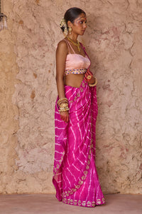 Raj Nikhar – Beetroot Purple Leheriya Saree with Light Peach Double Strap Blouse