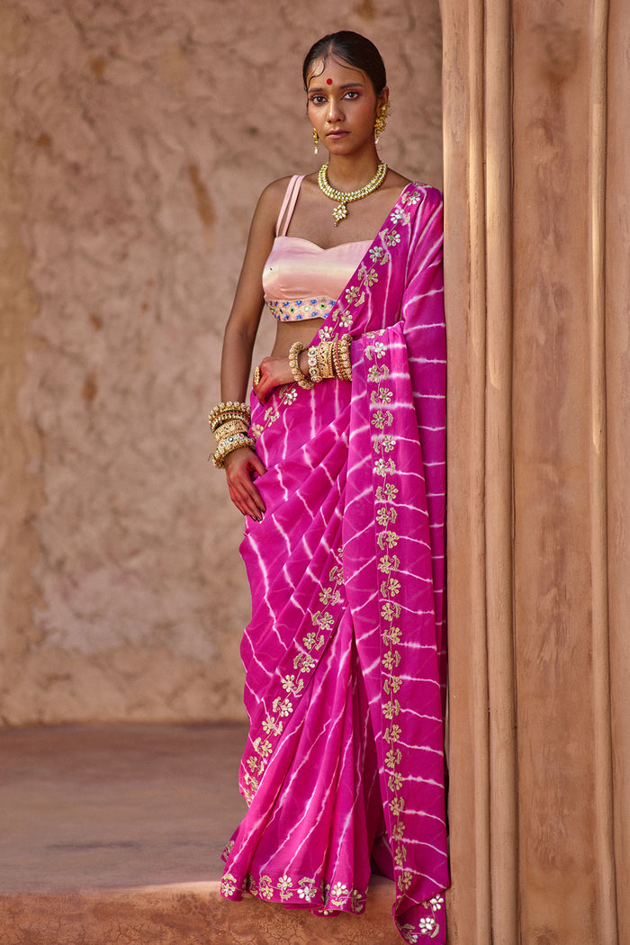 Raj Nikhar – Beetroot Purple Leheriya Saree with Light Peach Double Strap Blouse