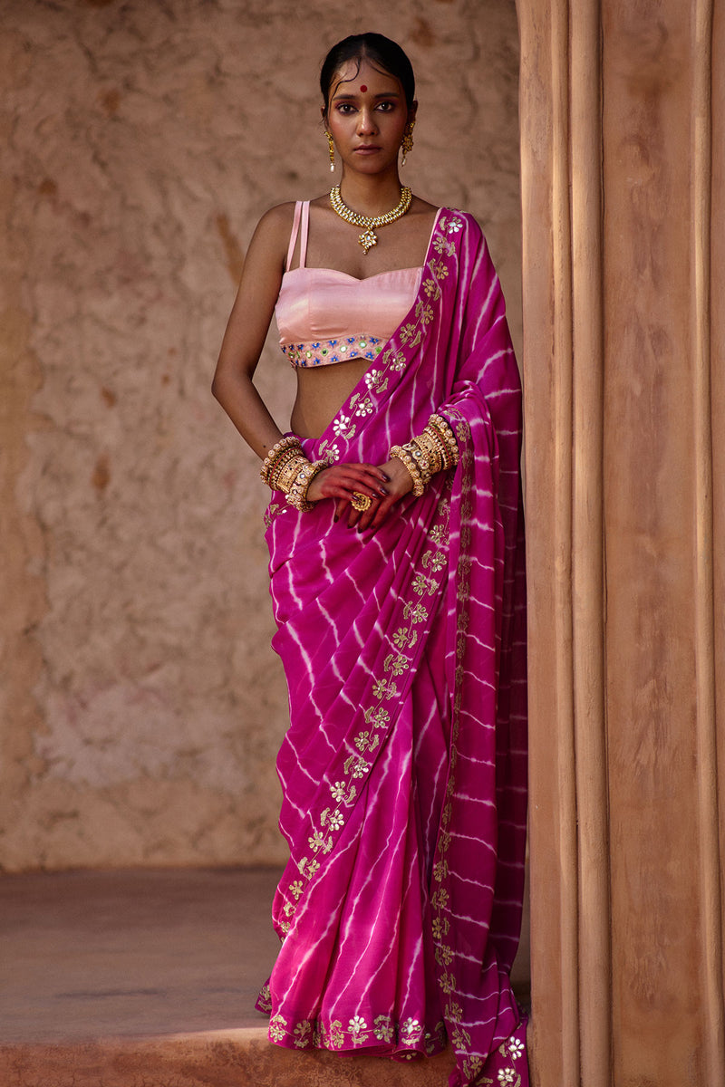 Raj Nikhar – Beetroot Purple Leheriya Saree with Light Peach Double Strap Blouse