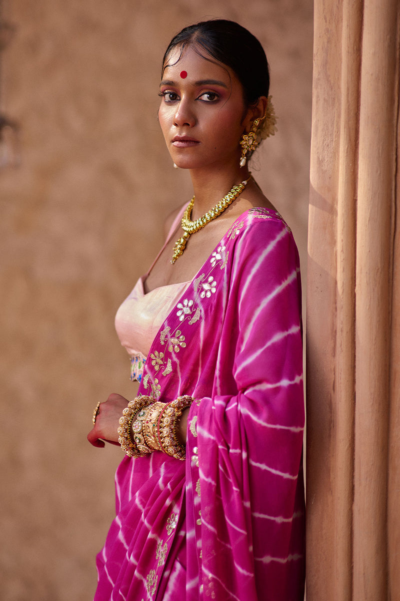 Raj Nikhar – Beetroot Purple Leheriya Saree with Light Peach Double Strap Blouse