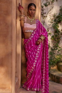 Raj Nikhar – Beetroot Purple Leheriya Saree with Light Peach Double Strap Blouse