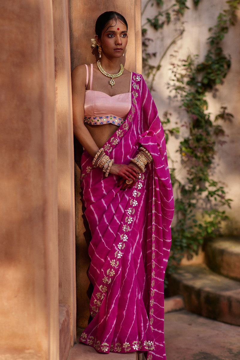 Raj Nikhar – Beetroot Purple Leheriya Saree with Light Peach Double Strap Blouse