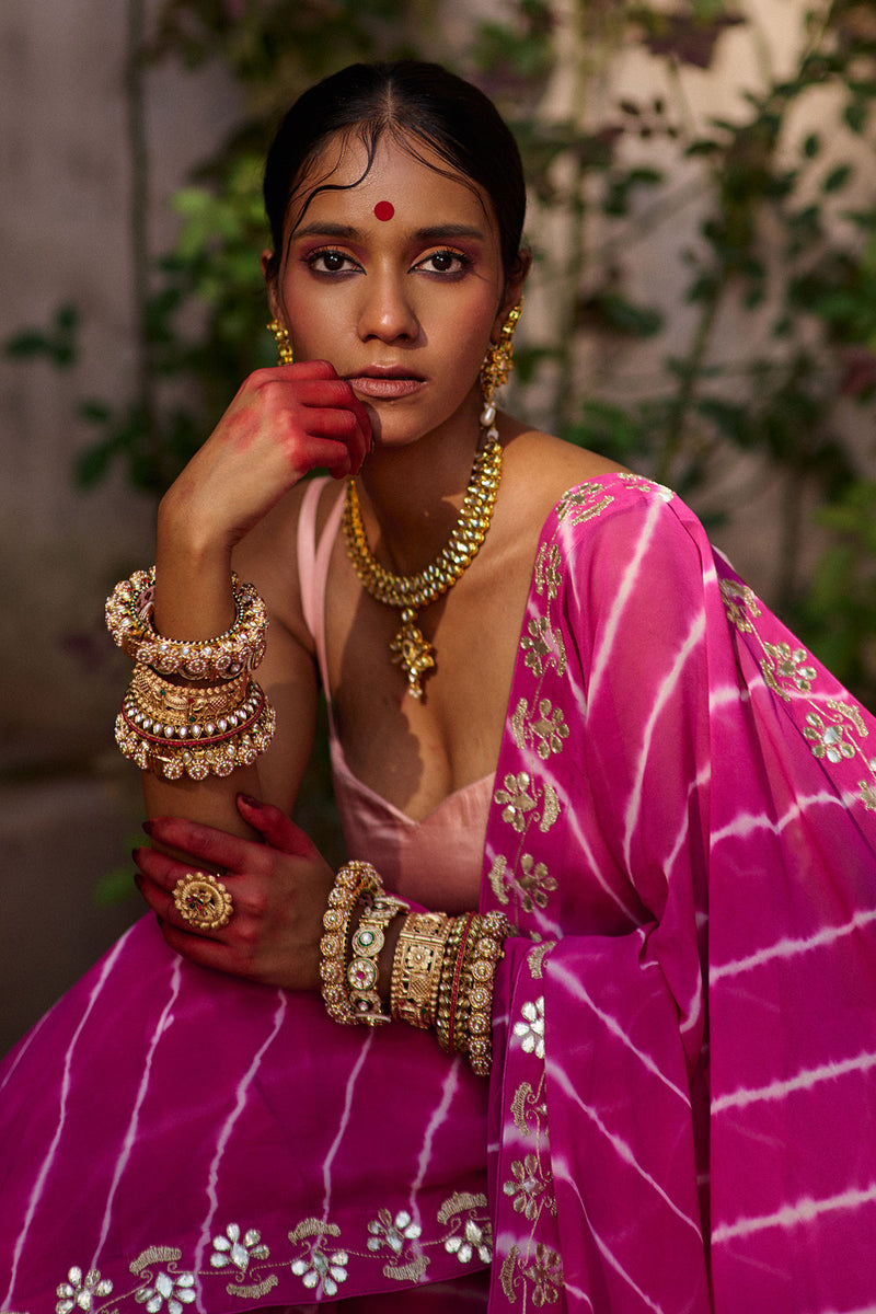 Raj Nikhar – Beetroot Purple Leheriya Saree with Light Peach Double Strap Blouse