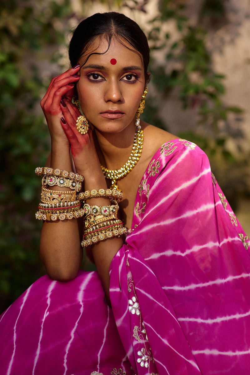 Raj Nikhar – Beetroot Purple Leheriya Saree with Light Peach Double Strap Blouse