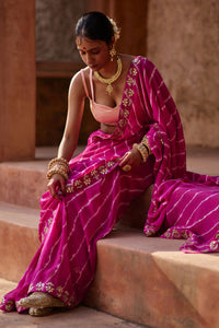 Raj Nikhar – Beetroot Purple Leheriya Saree with Light Peach Double Strap Blouse