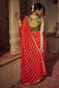 Rajbala – Red Leheriya Saree with Olive Green Blouse