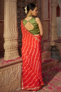 Rajbala – Red Leheriya Saree with Olive Green Blouse
