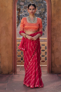 Charumati – Red Leheriya Saree with Light Orange Blouse