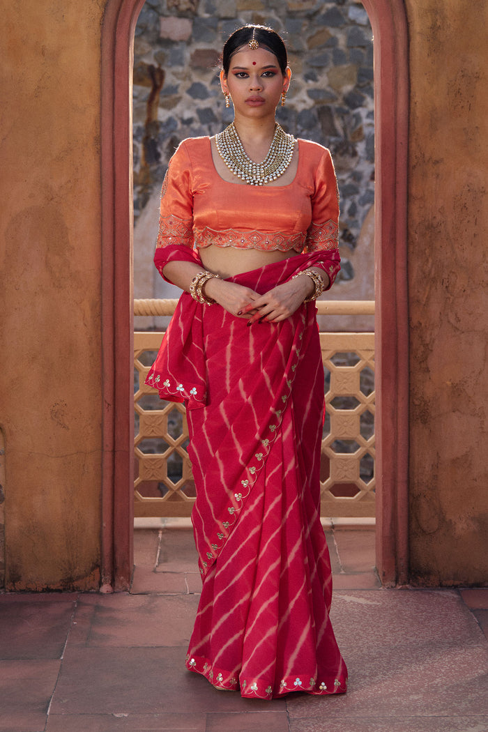 Charumati – Red Leheriya Saree with Light Orange Blouse