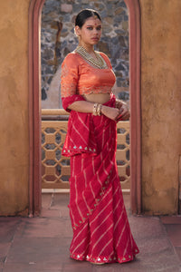 Charumati – Red Leheriya Saree with Light Orange Blouse