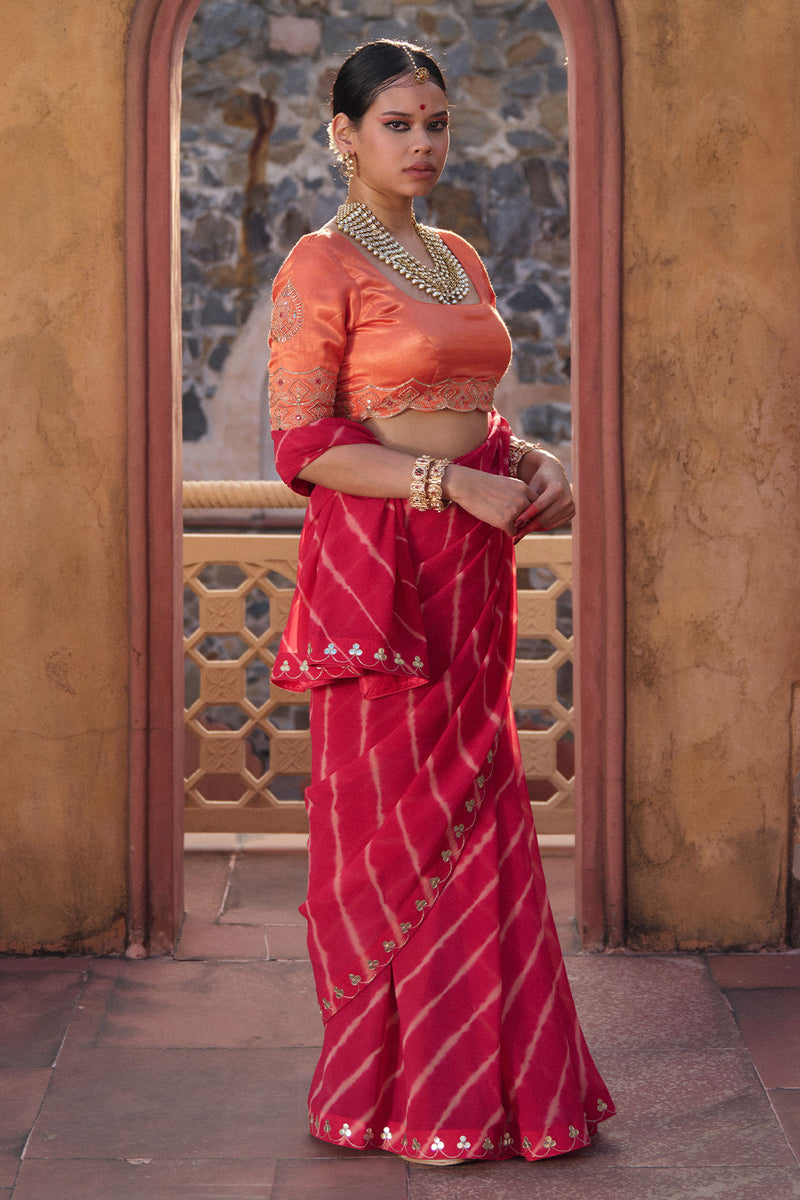 Charumati – Red Leheriya Saree with Light Orange Blouse