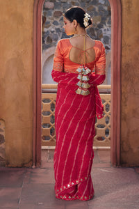 Charumati – Red Leheriya Saree with Light Orange Blouse