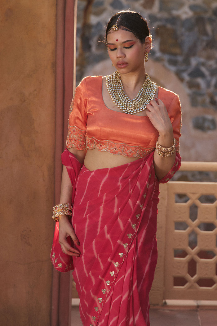 Charumati – Red Leheriya Saree with Light Orange Blouse