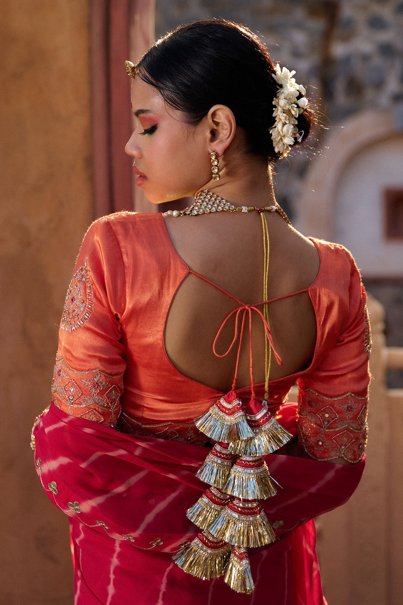 Charumati – Red Leheriya Saree with Light Orange Blouse