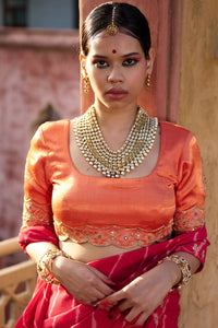 Charumati – Red Leheriya Saree with Light Orange Blouse