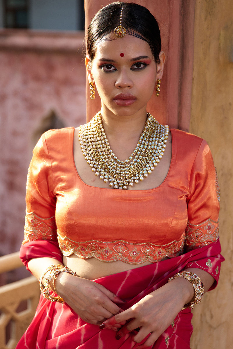 Charumati – Red Leheriya Saree with Light Orange Blouse