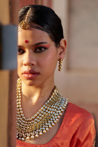 Charumati – Red Leheriya Saree with Light Orange Blouse