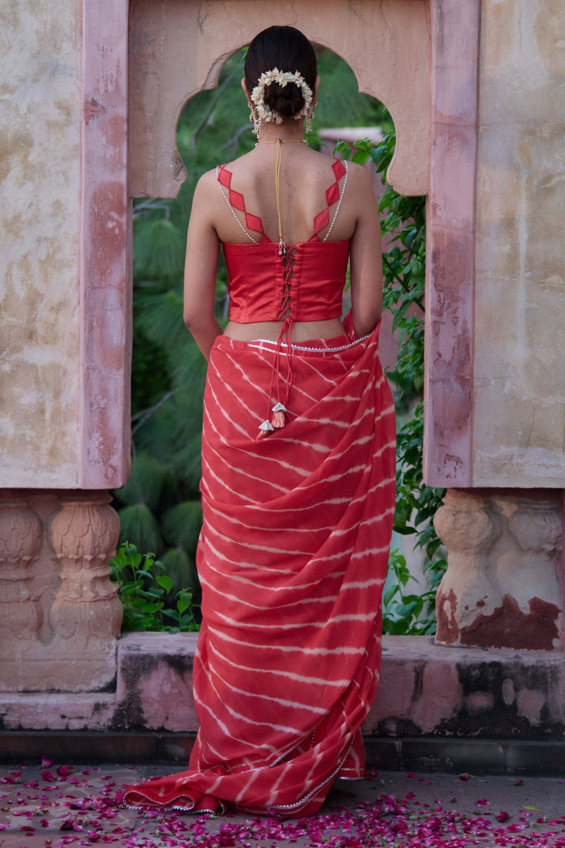 Tarangini – Watermelon Leheriya Saree and Corset Blouse with Pearl Strings